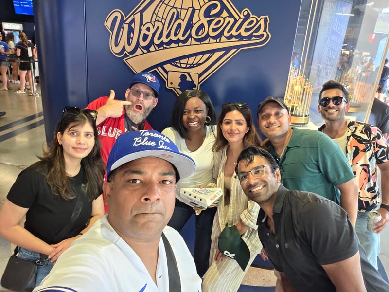 Canada team selfie at a Toronto Blue Jays game in front of the World Series display